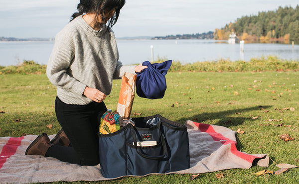 A person setting up a picnic with a Monster Truck.